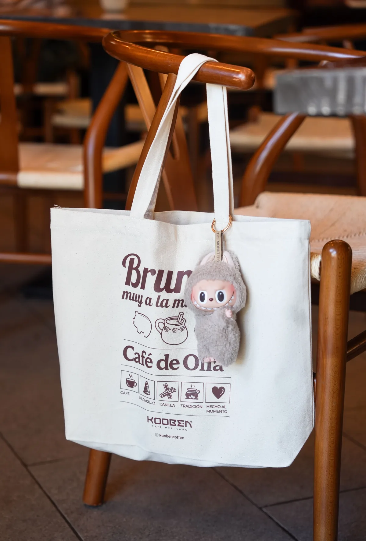 Cream Café de Olla tote bag displayed inside Kooben Café Mexicano